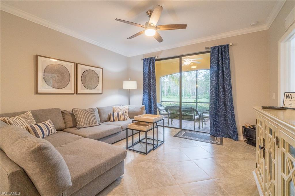 9596 Trevi Court, Unit 5414 Naples, FL 34113 - Photo 1 of 34 a living room with furniture and a fireplace