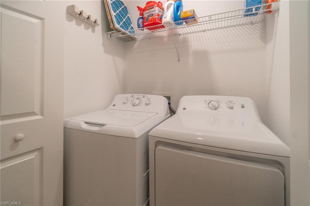 9596 Trevi Court, Unit 5414 Naples, FL 34113 - Photo 18 of 34 a utility room with dryer and washer
