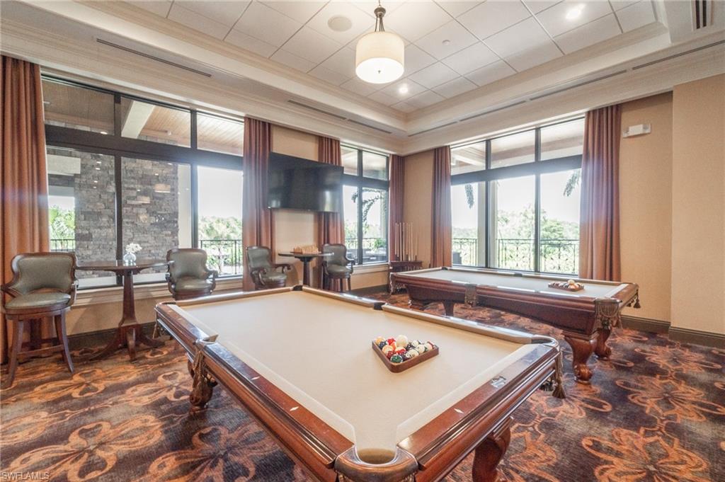 9596 Trevi Court, Unit 5414 Naples, FL 34113 - Photo 34 of 34 a room with pool table and windows