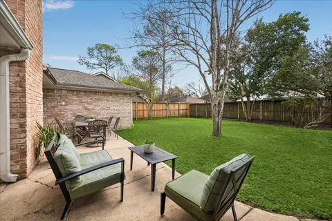 a view of a backyard with furniture