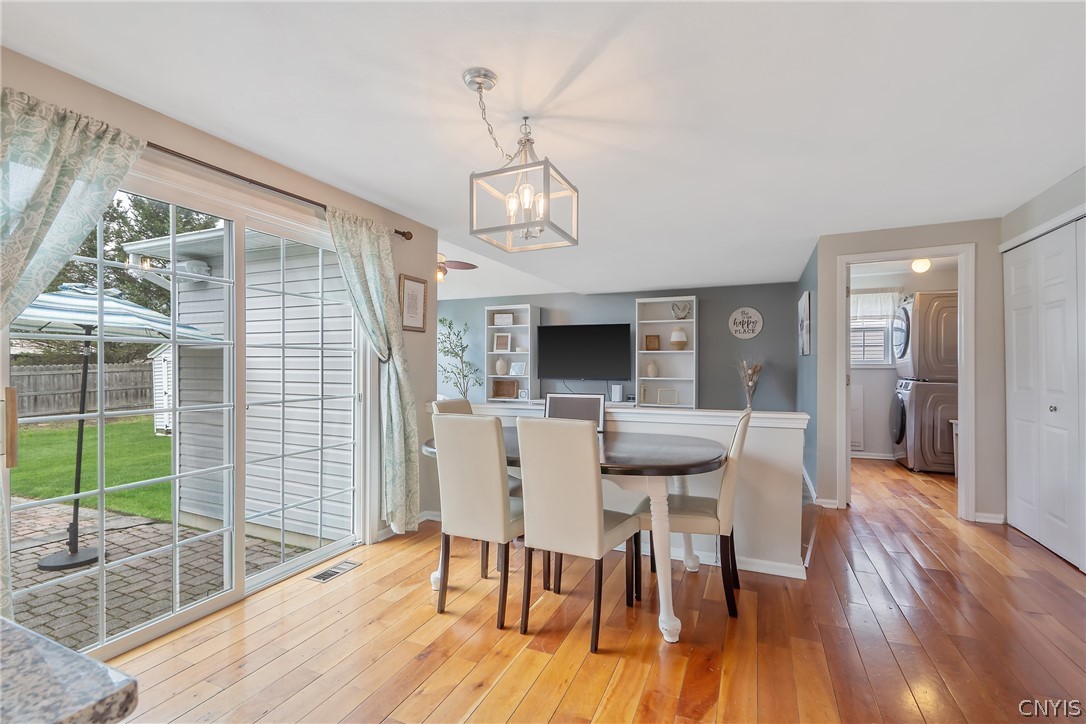 6028 Monopoli Path Cicero, NY 13039 - Photo 14 of 39 Eat in space with sliders to patio and yard