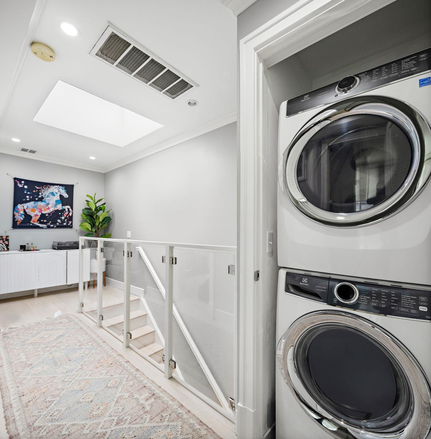 313 Washington Street, Unit 7 Hoboken, NJ 07030 - Photo 11 of 15 a view of a hallway with washer and dryer