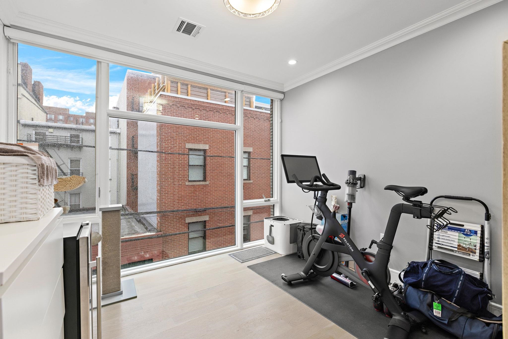 313 Washington Street, Unit 7 Hoboken, NJ 07030 - Photo 8 of 15 a view of a room with gym equipment