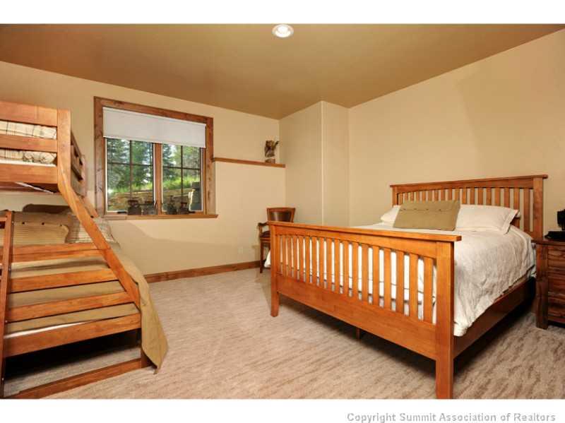 12 Rounds Road Breckenridge, CO 80424 - Photo 11 of 23 a view of a bedroom with wooden floor and windows