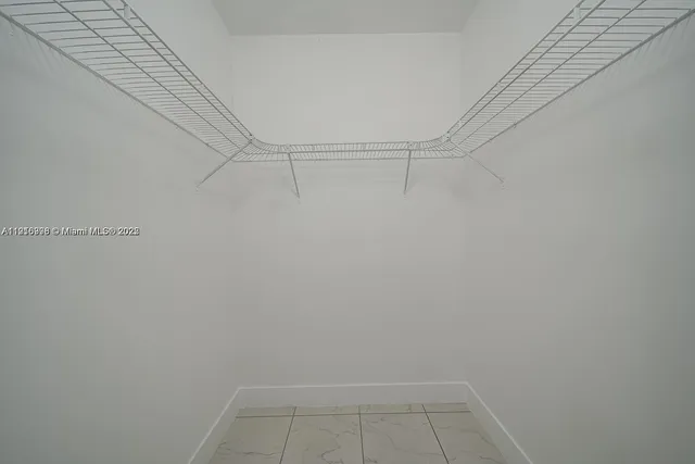 an empty room with white walls