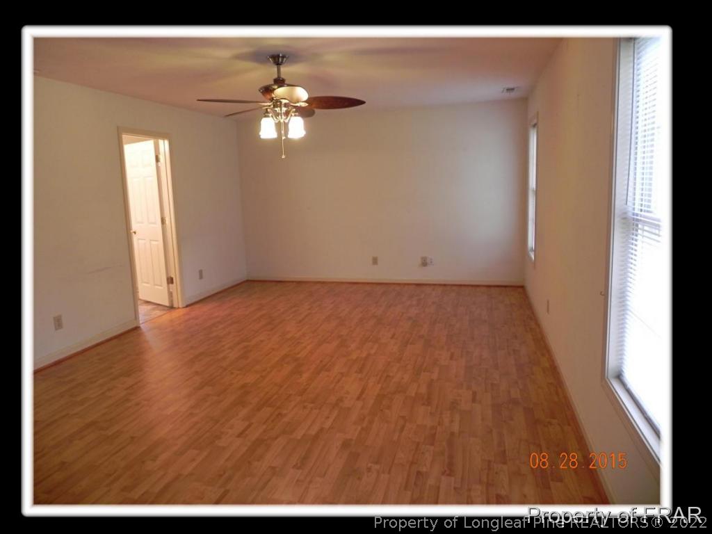 596 East Lake Ridge Road Raeford, NC 28376 - Photo 16 of 25 a view of an empty room with wooden floor
