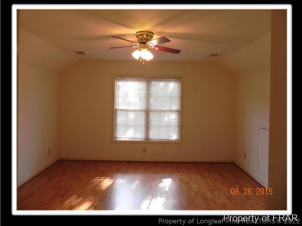596 East Lake Ridge Road Raeford, NC 28376 - Photo 21 of 25 a view of an empty room with a window