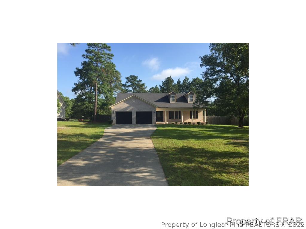 596 East Lake Ridge Road Raeford, NC 28376 - Photo 24 of 25 a view of house with garden