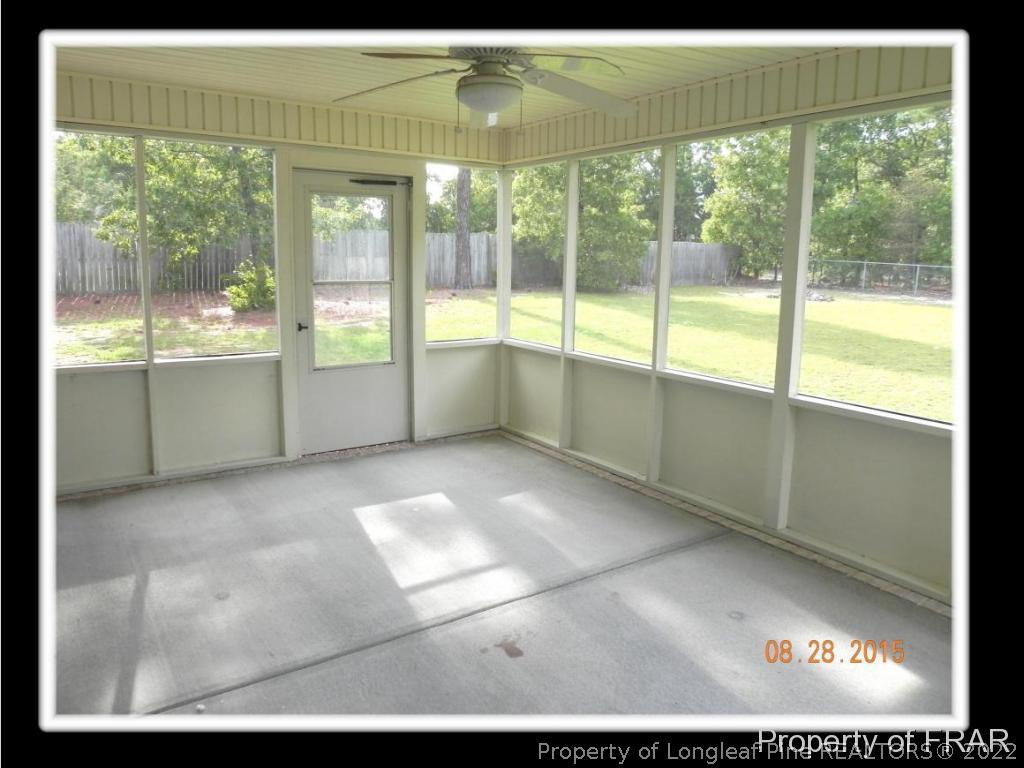 596 East Lake Ridge Road Raeford, NC 28376 - Photo 5 of 25 a view of an empty room with a window