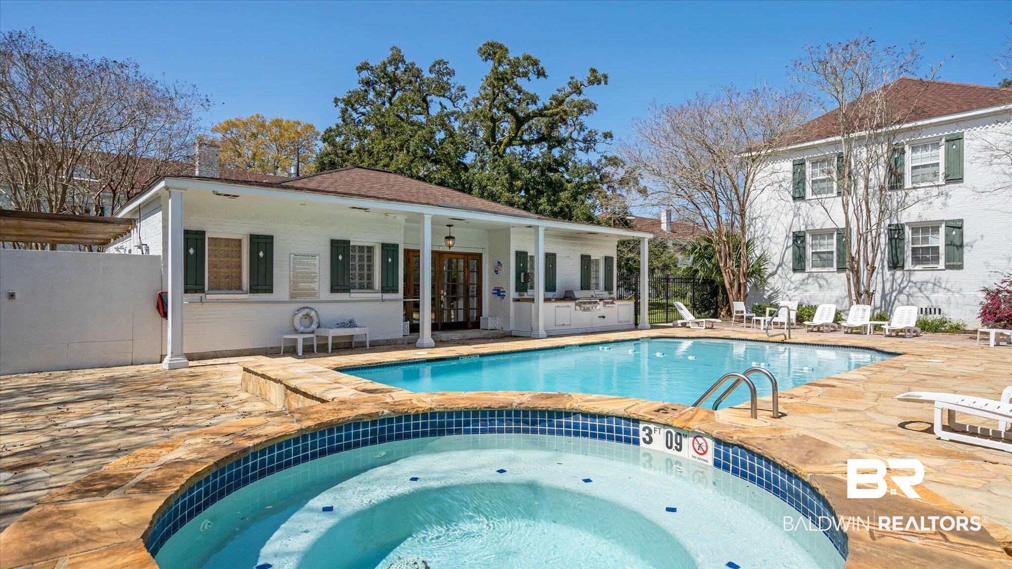 214 Upham Street, Unit 18C Mobile, AL 36607 - Photo 31 of 35 View of swimming pool featuring an in-ground hot tub, a patio area, french doors, and fence