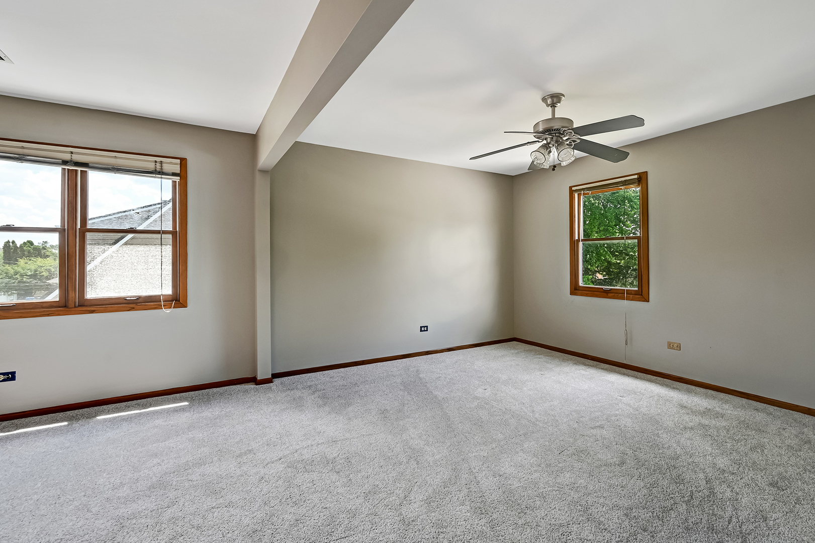 10511 South Hamlin Avenue Chicago, IL 60655 - Photo 17 of 23 an empty room with windows and fan