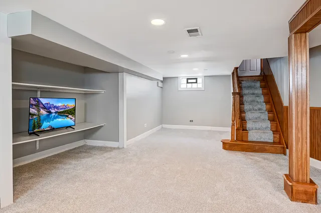 a view of an empty room with stairs