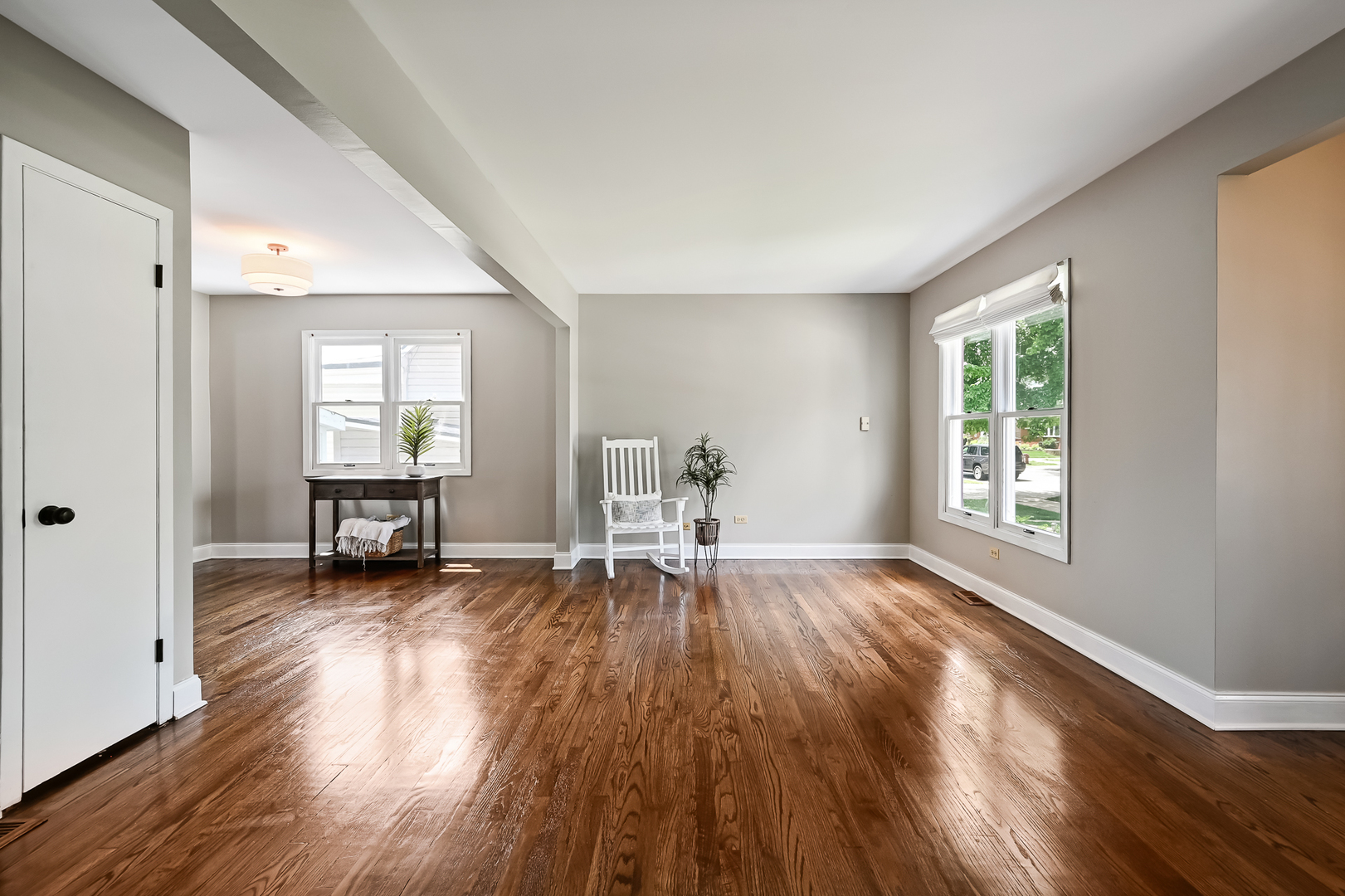 10511 South Hamlin Avenue Chicago, IL 60655 - Photo 4 of 23 a view of empty room with wooden floor and a window
