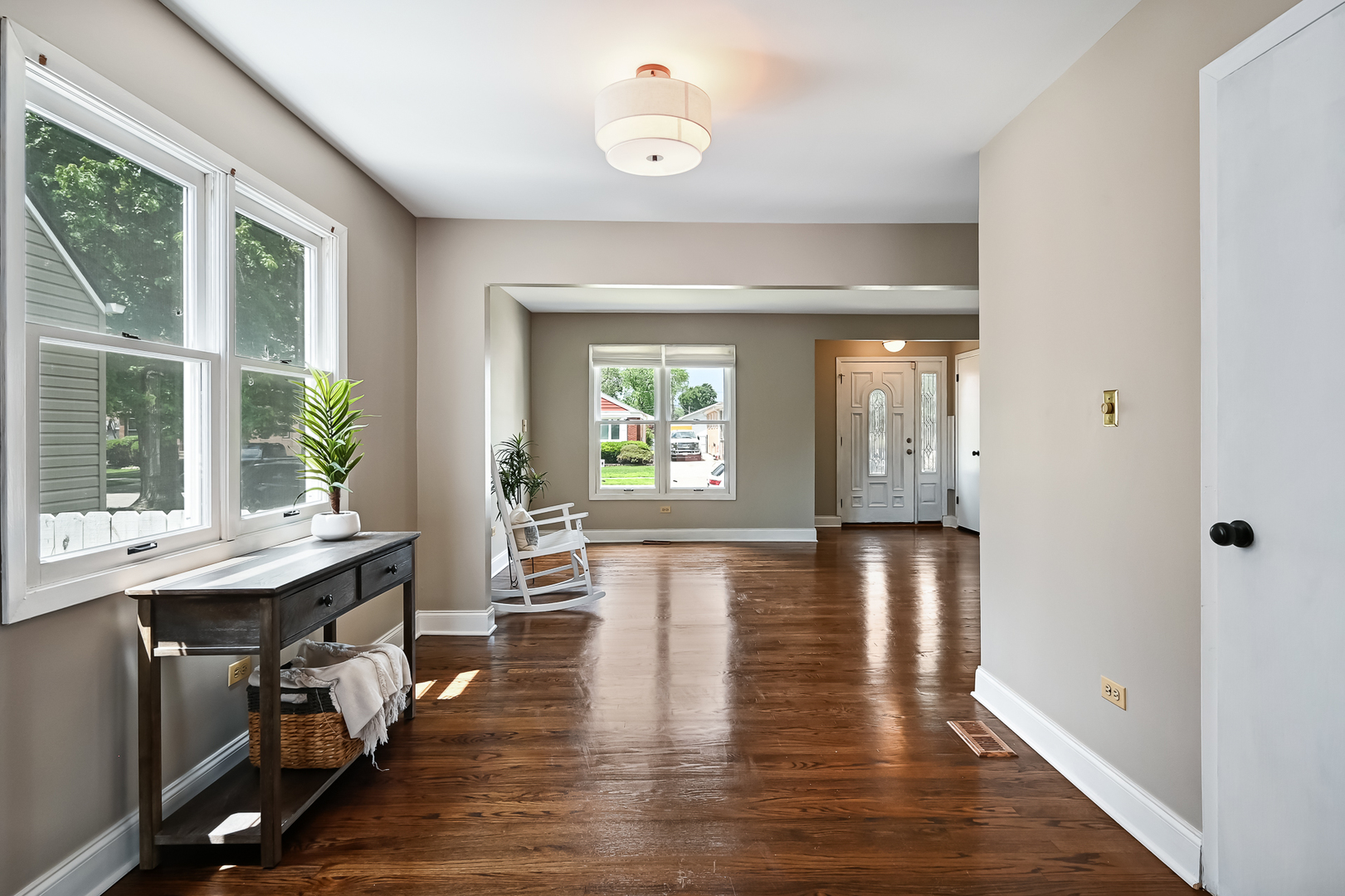 10511 South Hamlin Avenue Chicago, IL 60655 - Photo 6 of 23 a view of a hallway with wooden floor and windows
