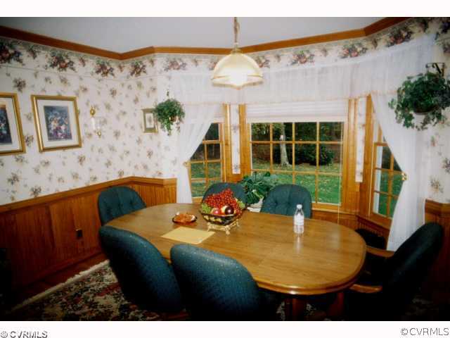 13241 Carters Way Road Chesterfield, VA 23838 - Photo 4 of 11 a view of a dining room with furniture and a potted plant