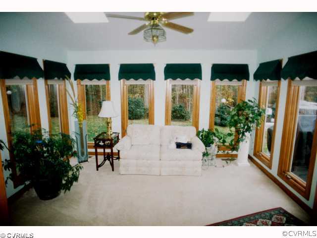 13241 Carters Way Road Chesterfield, VA 23838 - Photo 6 of 11 a living room with furniture potted plant and a large window