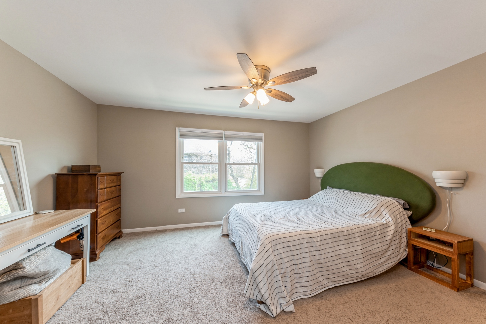 151 East Palatine Road, Unit 4 Palatine, IL 60067 - Photo 11 of 17 a bedroom with a bed and a chandelier