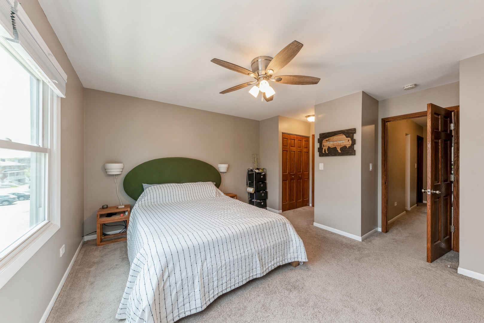 151 East Palatine Road, Unit 4 Palatine, IL 60067 - Photo 12 of 17 a spacious bedroom with a bed and a large window