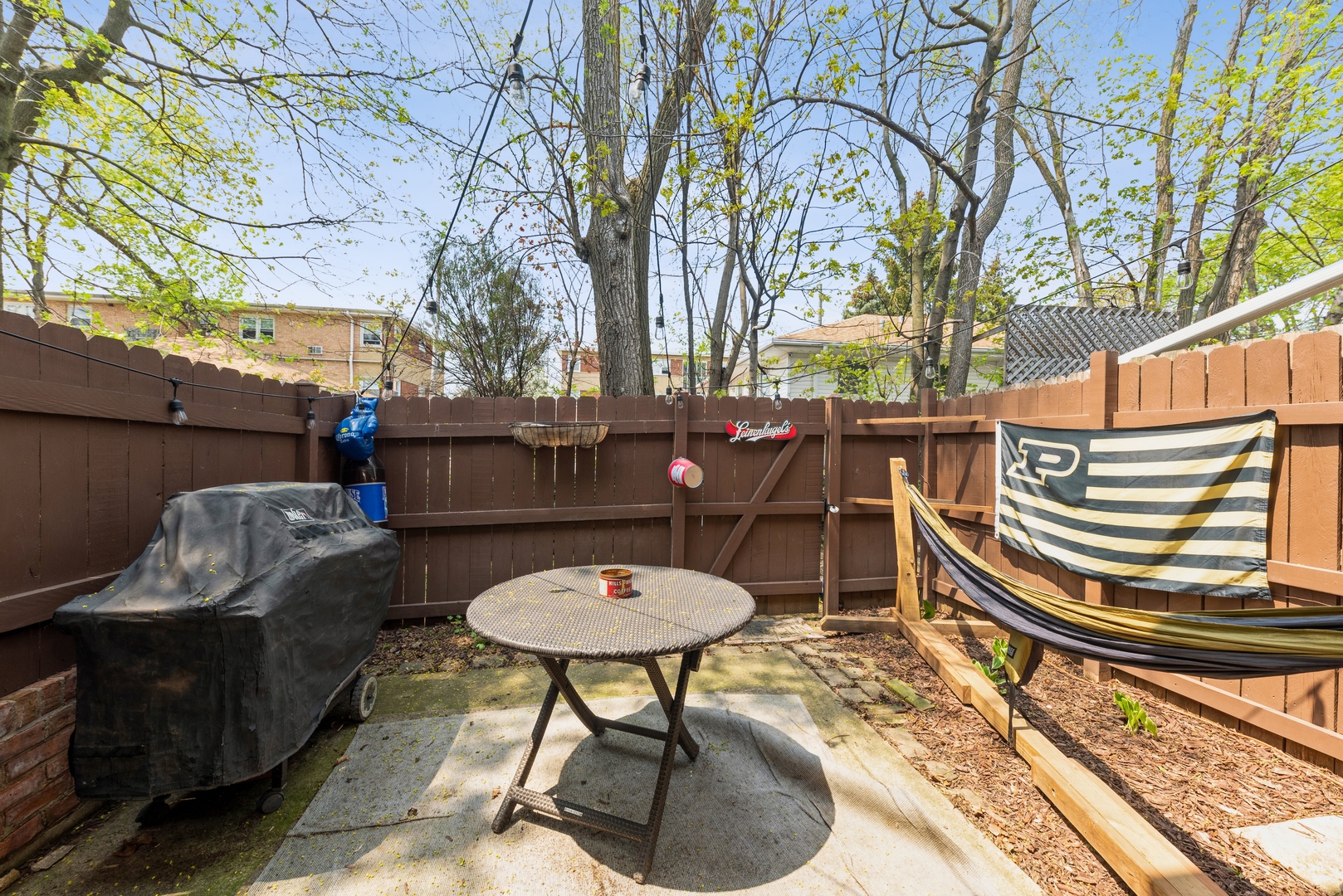 151 East Palatine Road, Unit 4 Palatine, IL 60067 - Photo 17 of 17 a backyard of a house with table and chairs