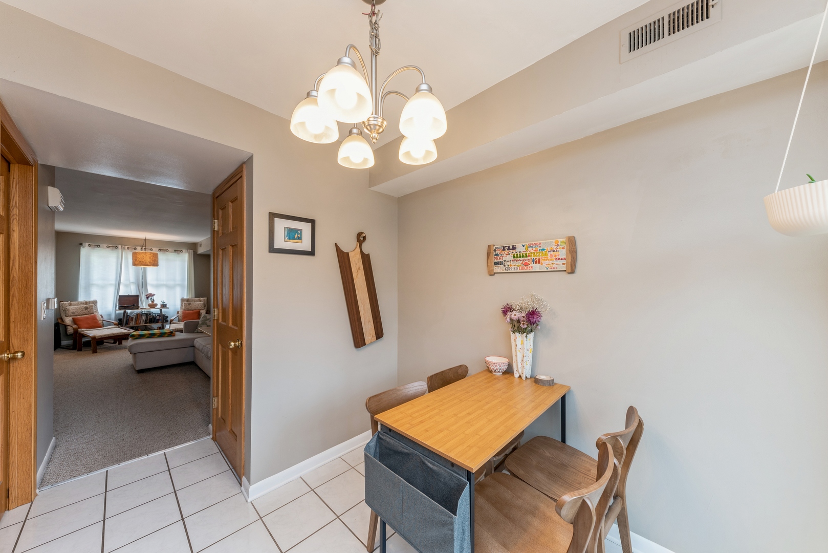 151 East Palatine Road, Unit 4 Palatine, IL 60067 - Photo 9 of 17 a dining room with furniture and a chandelier