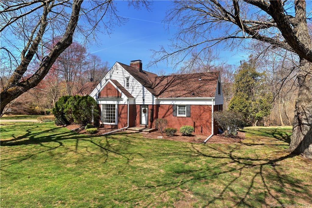 201 Wilson Road Orange, CT 06477 - Photo 1 of 1 a view of a house with backyard and sitting area
