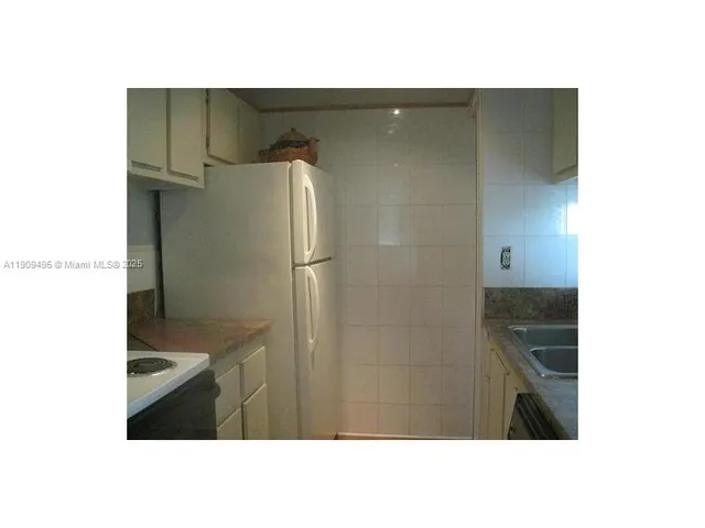 a picture of door with sky in background