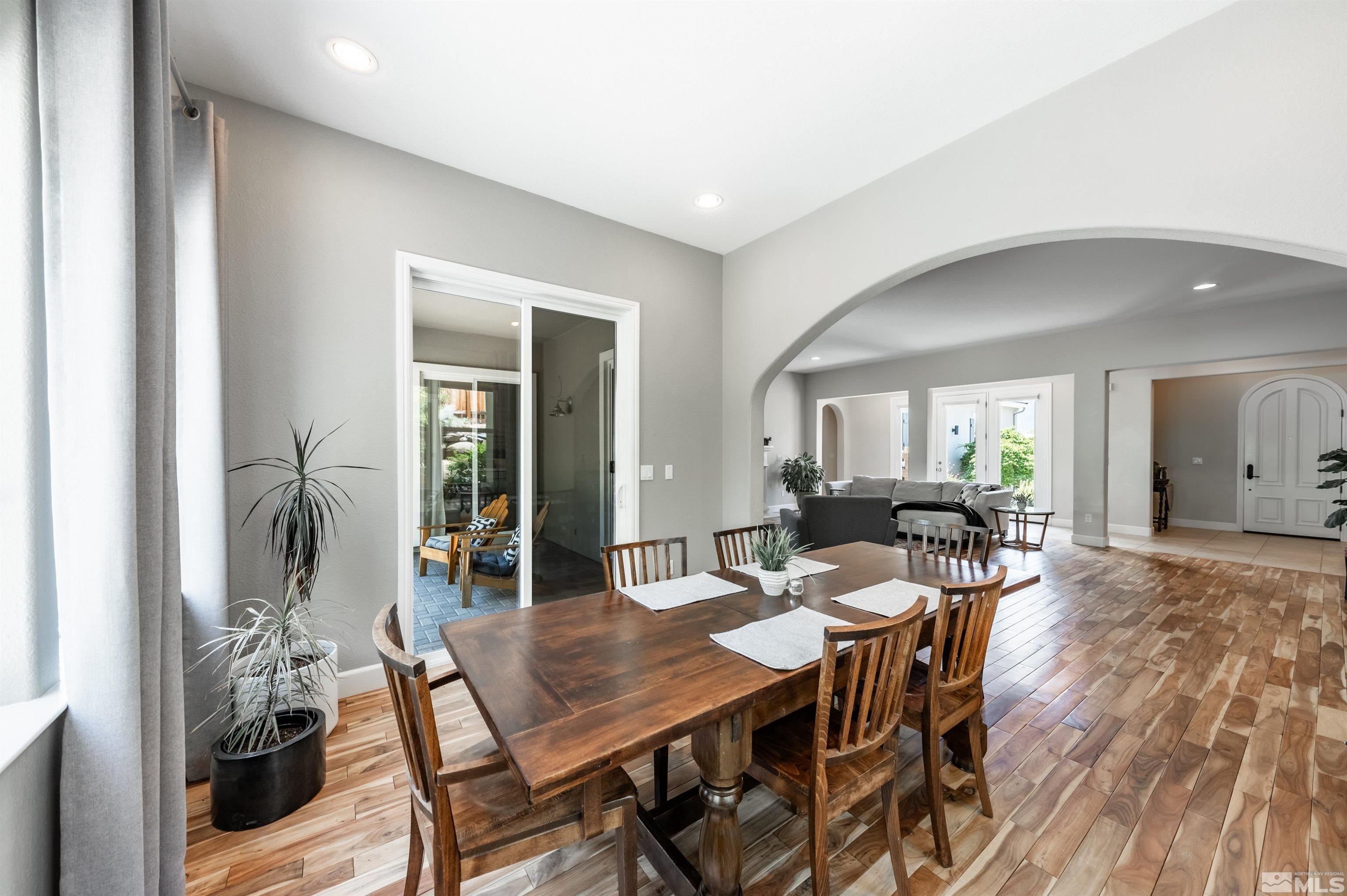8580 Timaru Trail Reno, NV 89523 - Photo 16 of 40 a view of a dining room with furniture and wooden floor