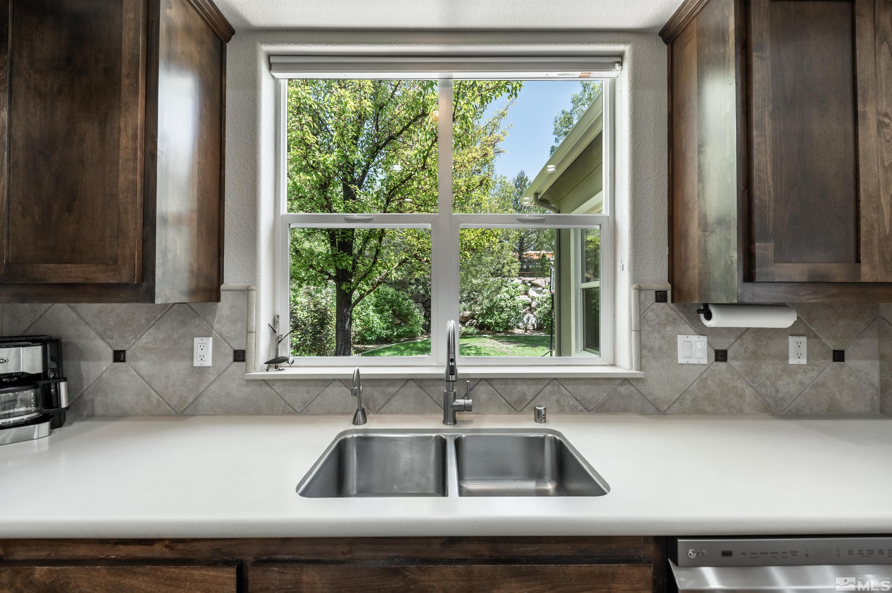 8580 Timaru Trail Reno, NV 89523 - Photo 20 of 40 a kitchen sink sitting next to a window