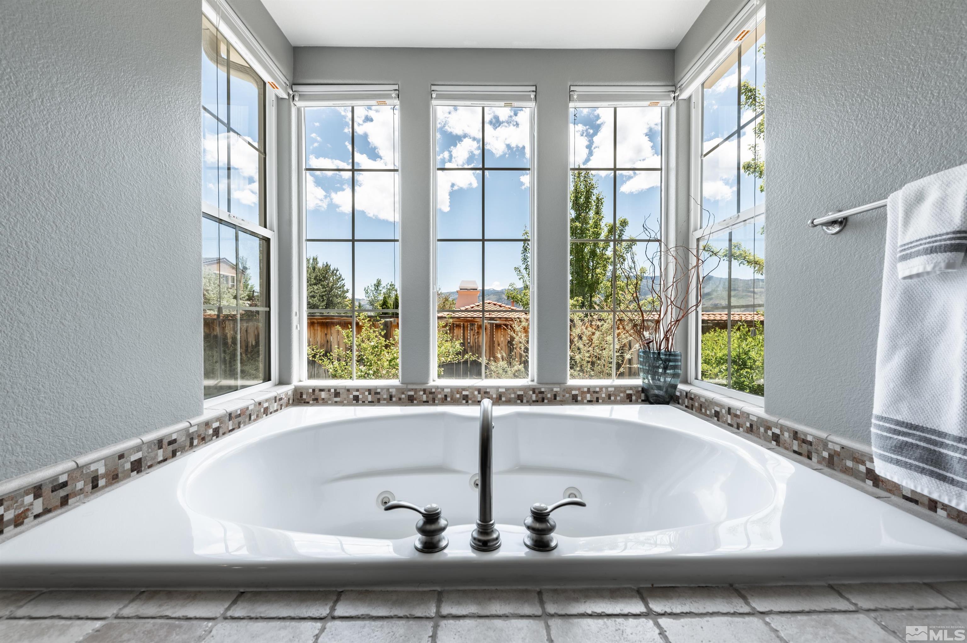 8580 Timaru Trail Reno, NV 89523 - Photo 27 of 40 a bath tub sitting in front of a window
