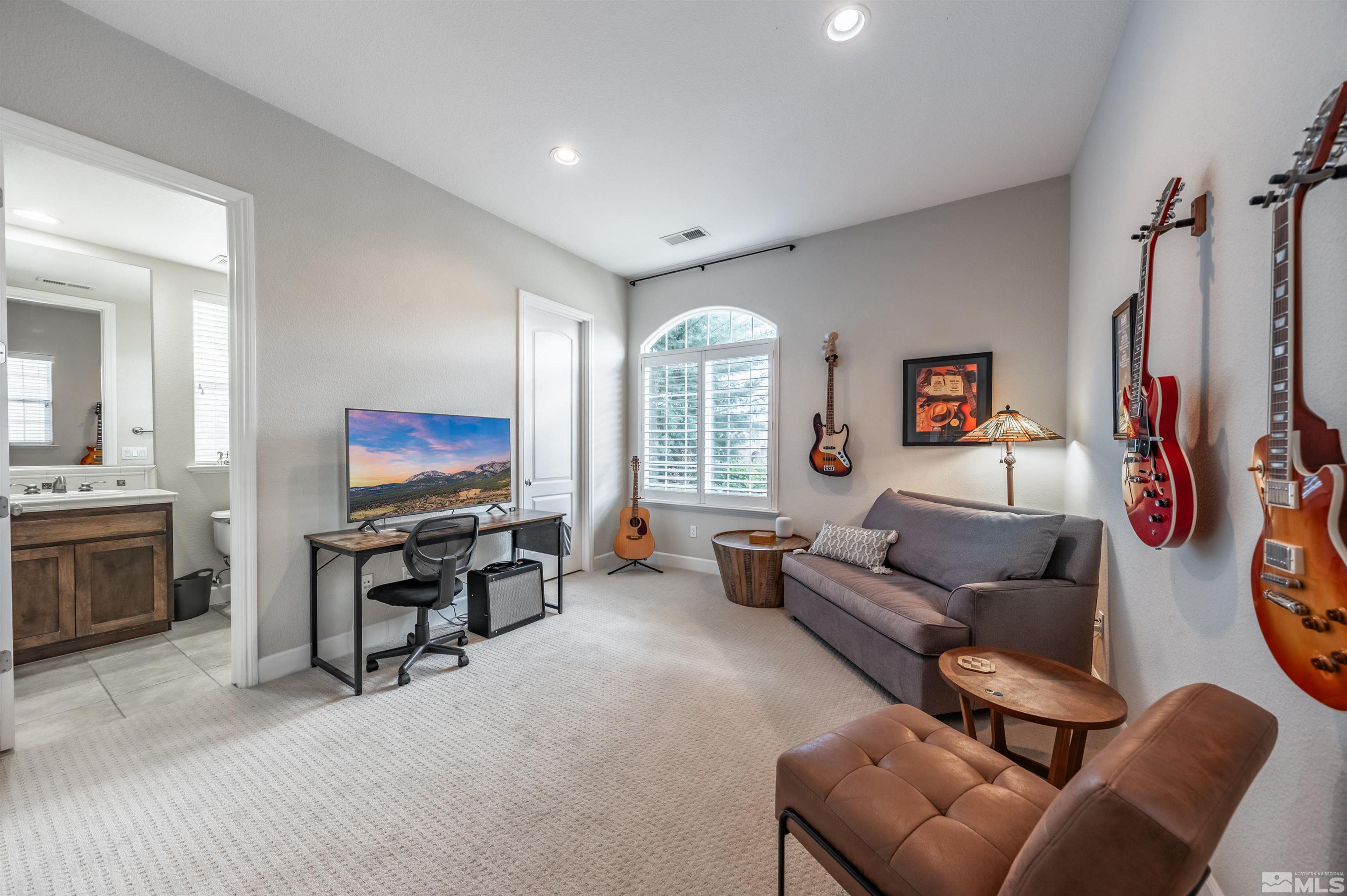 8580 Timaru Trail Reno, NV 89523 - Photo 29 of 40 a living room with furniture and a flat screen tv