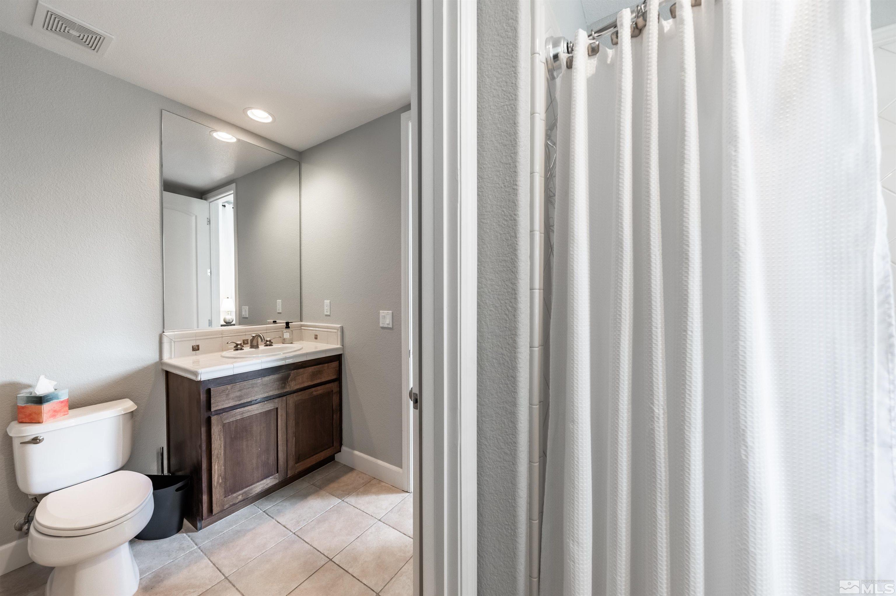 8580 Timaru Trail Reno, NV 89523 - Photo 31 of 40 a bathroom with a sink toilet and shower