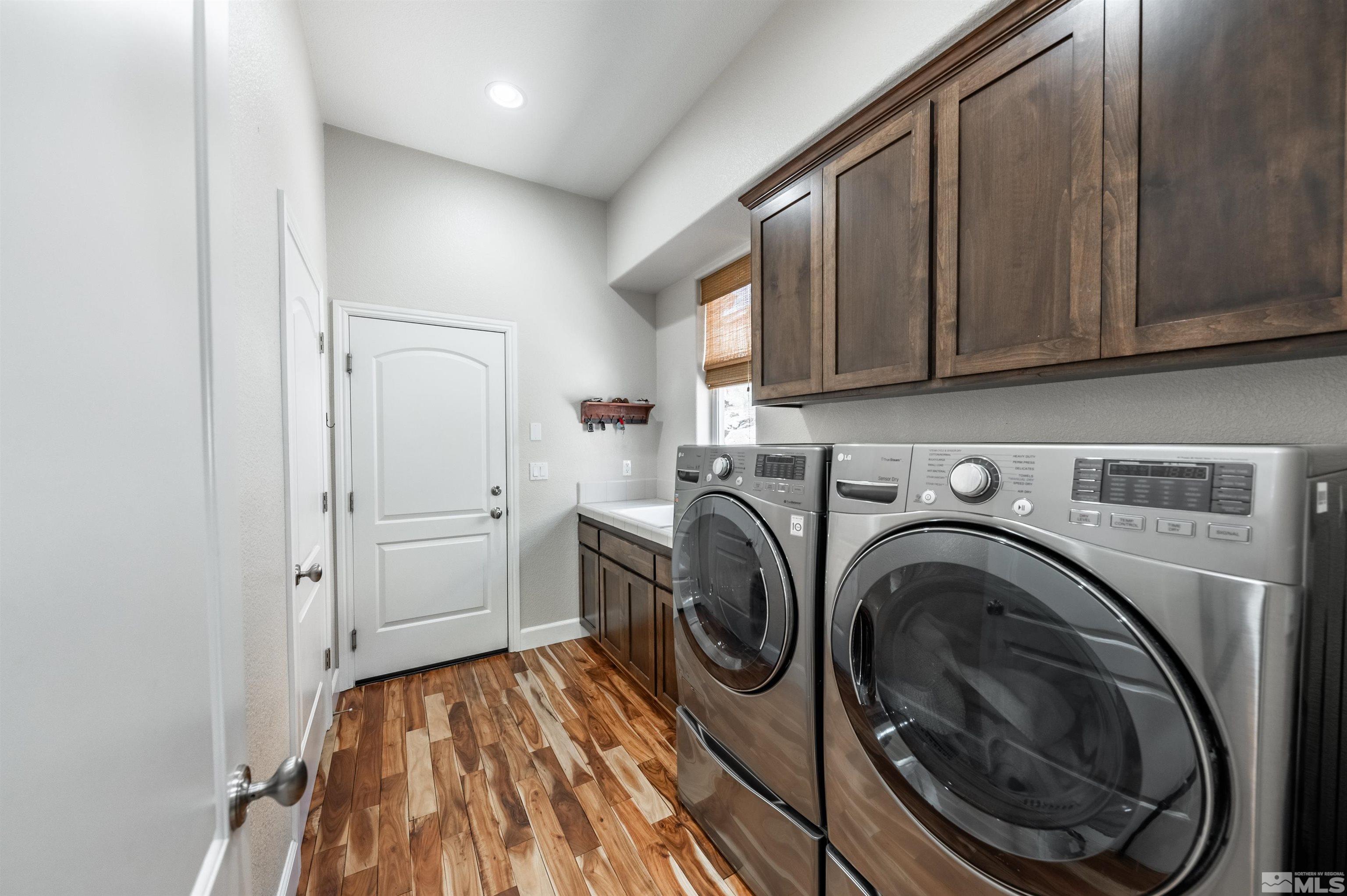 8580 Timaru Trail Reno, NV 89523 - Photo 37 of 40 a view of a storage and utility room with washer and dryer