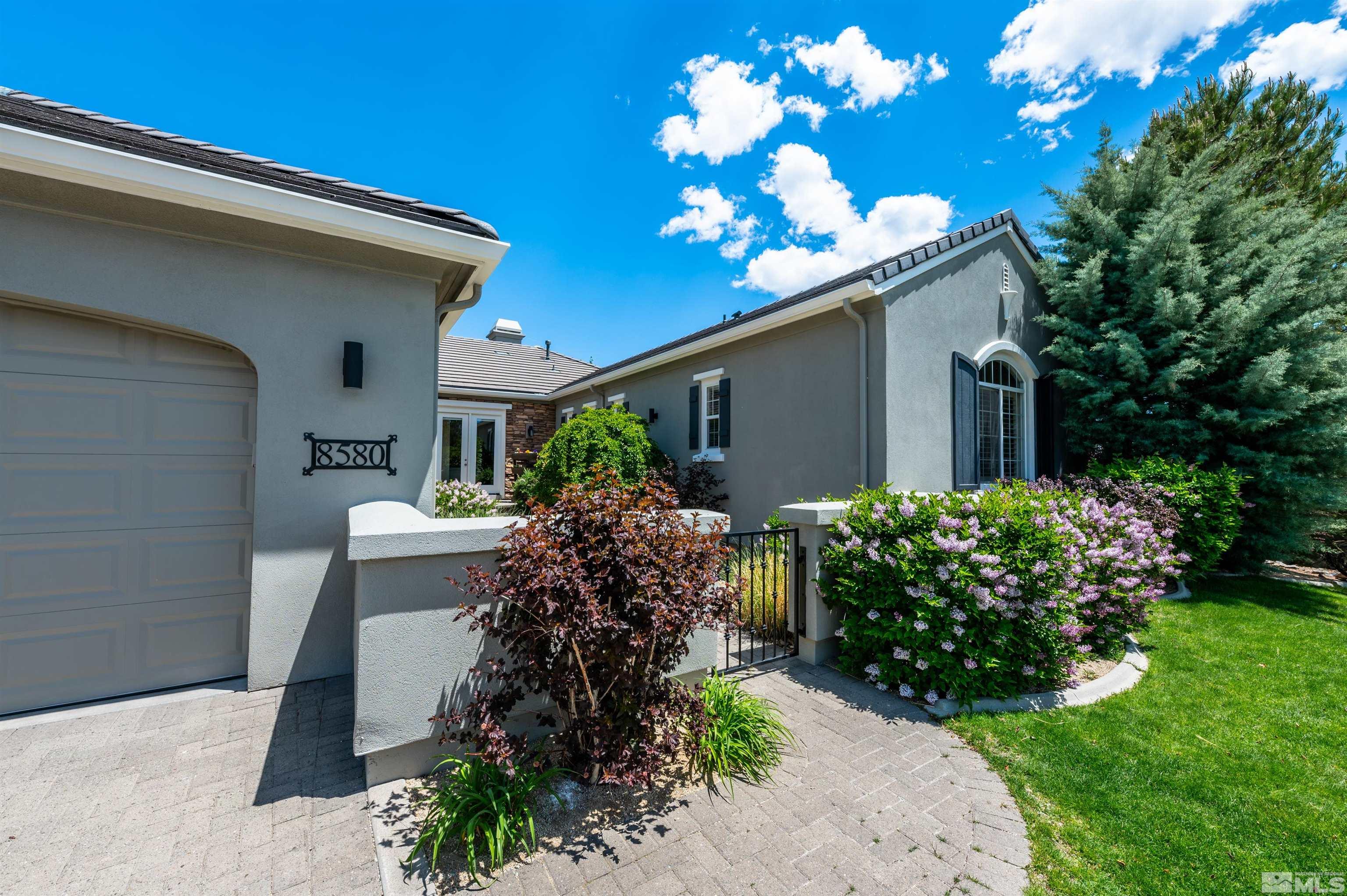 8580 Timaru Trail Reno, NV 89523 - Photo 5 of 40 a front view of a house with garden
