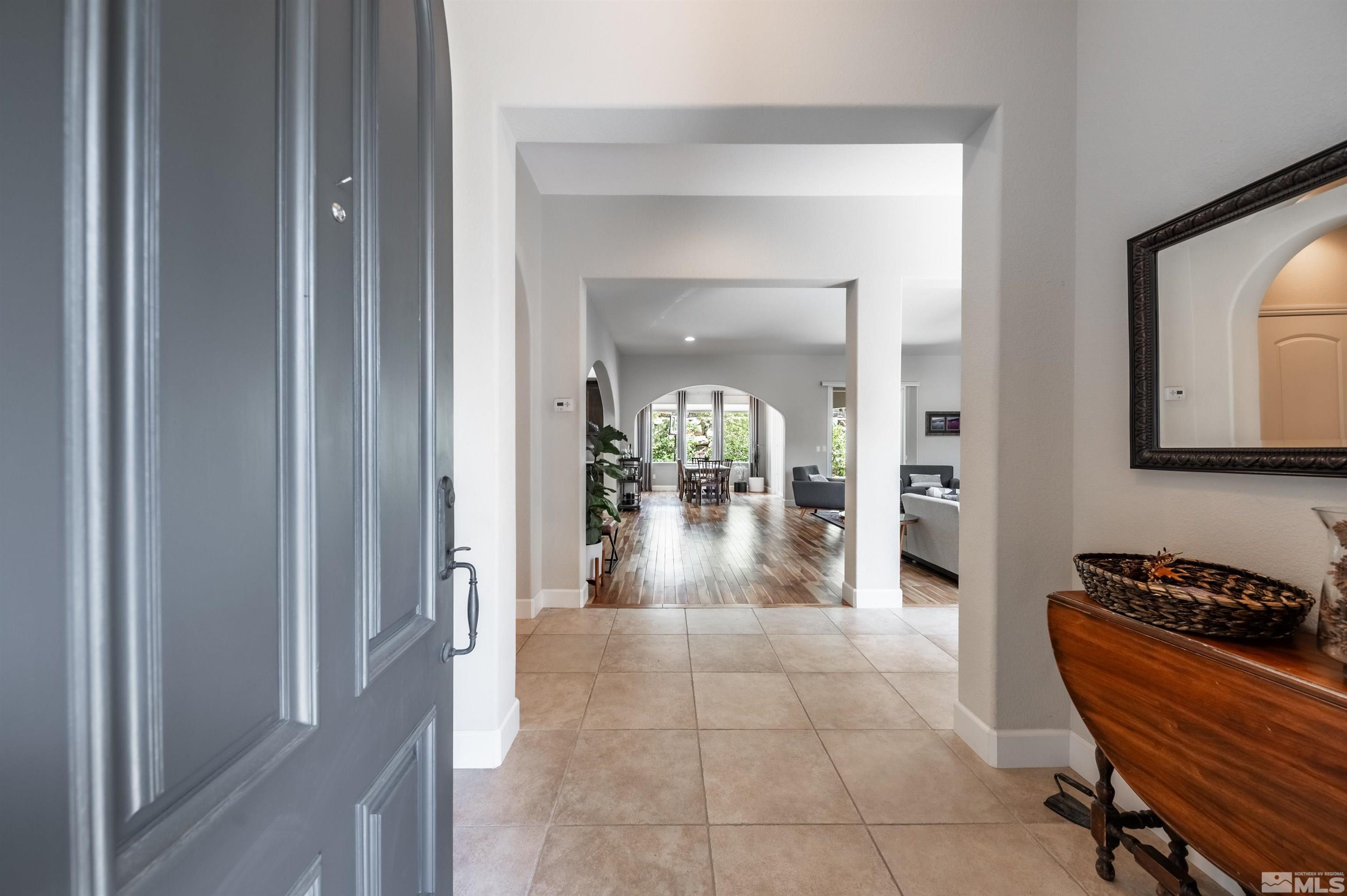 8580 Timaru Trail Reno, NV 89523 - Photo 8 of 40 a view of a hallway and dining room with a mirror