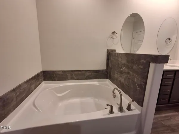 a bath tub sitting in a bathroom