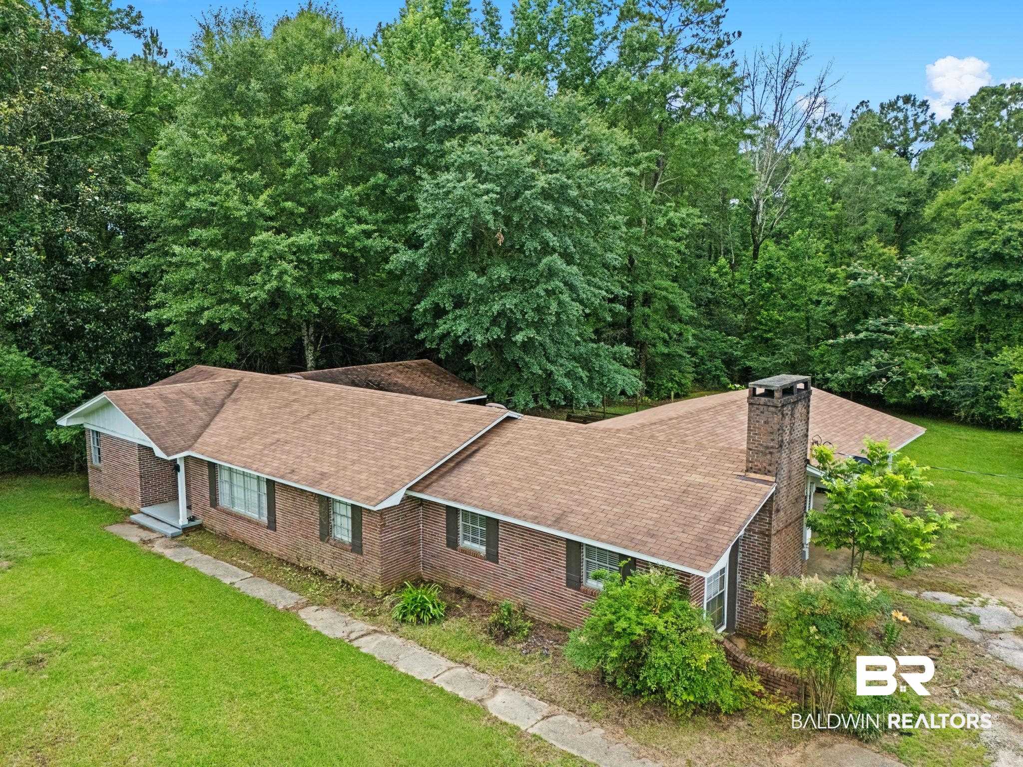 384 Old Bratt Road Atmore, AL 36502 - Photo 5 of 64 Brick exterior with brown shingle roofing