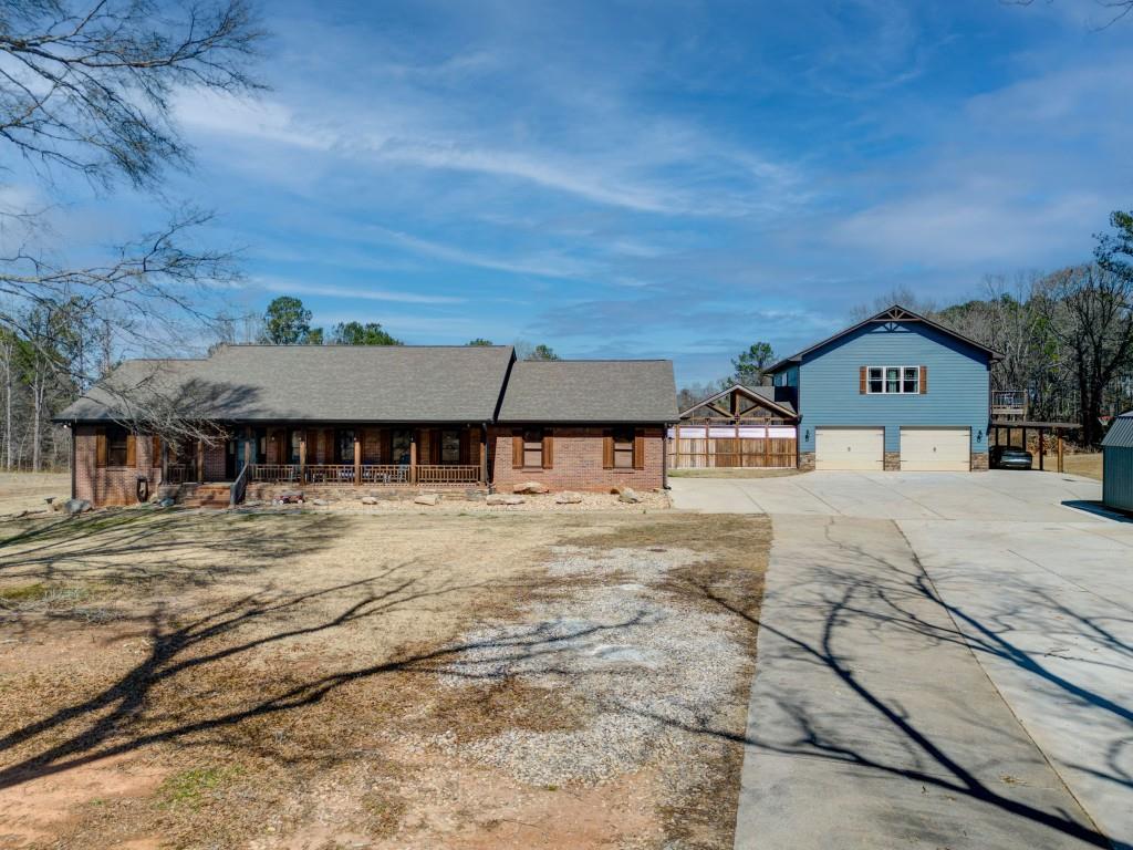 2853 West Ellis Road Griffin, GA 30223 - Photo 1 of 1 a front view of a house with a yard