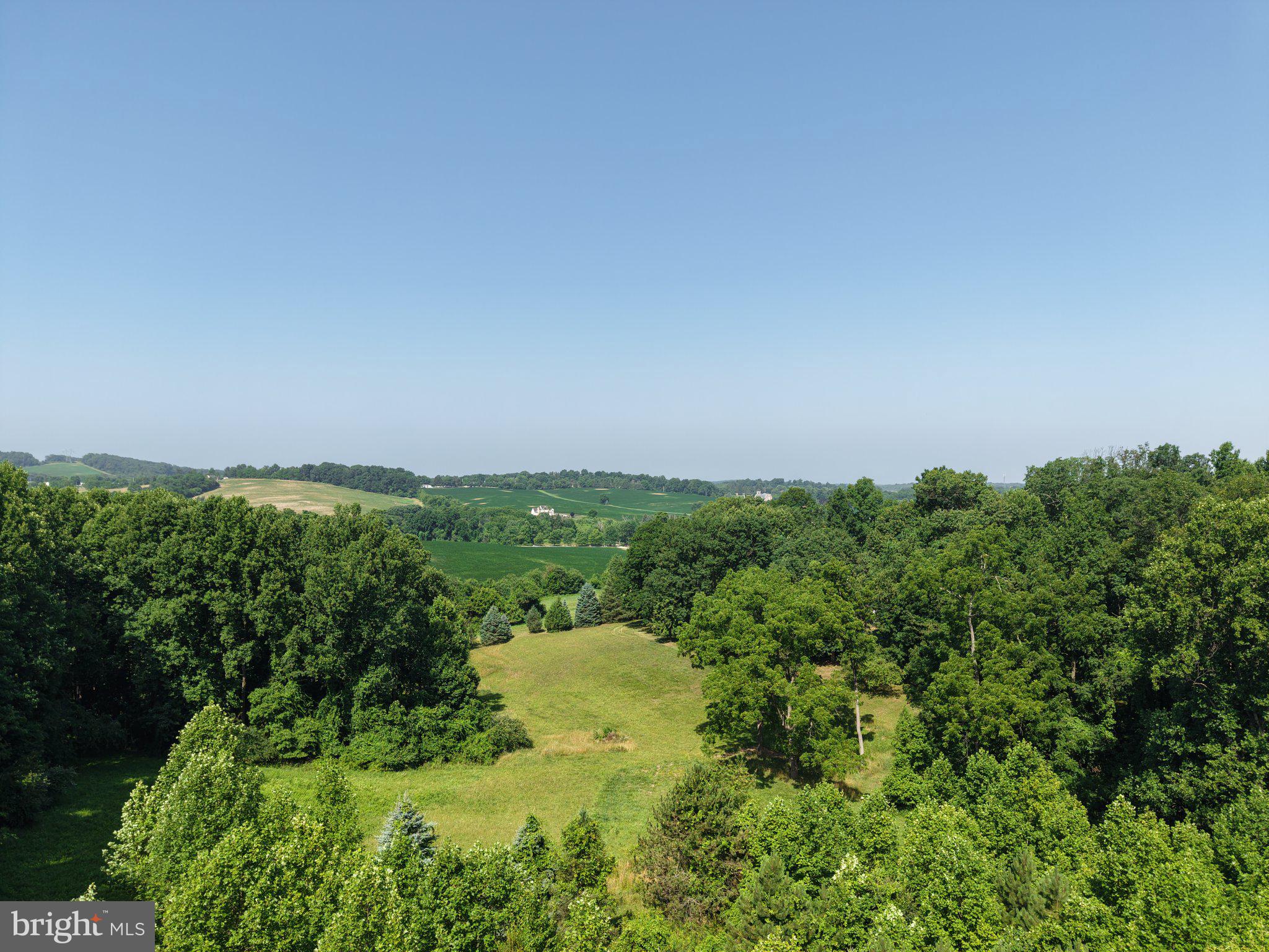 501 Tracey Road Hanover, PA 17331 - Photo 1 of 8 Lush green hills under a clear sky.