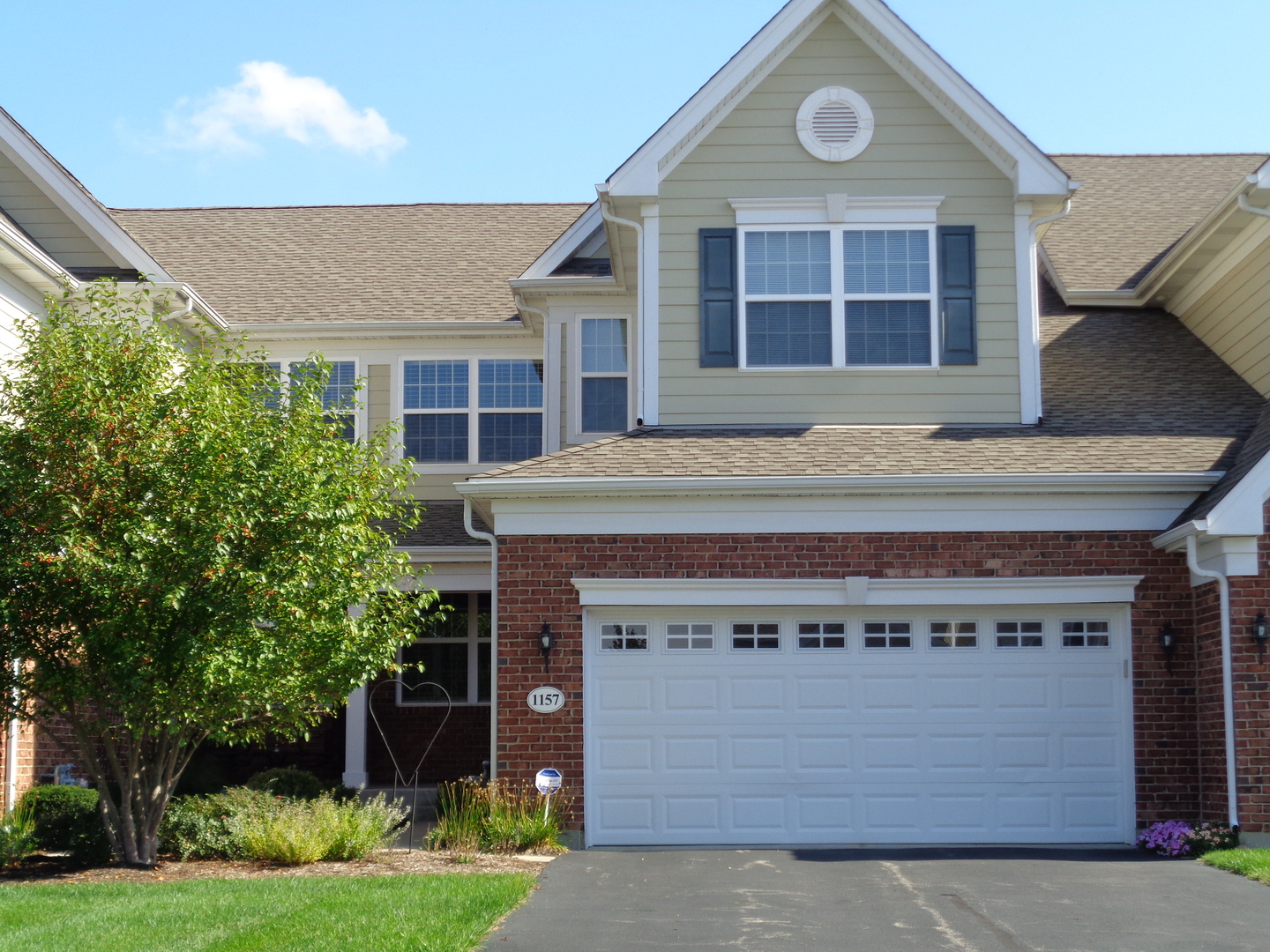 1157 Falcon Ridge Drive Elgin, IL 60124 - Photo 1 of 14 a front view of a house with a yard