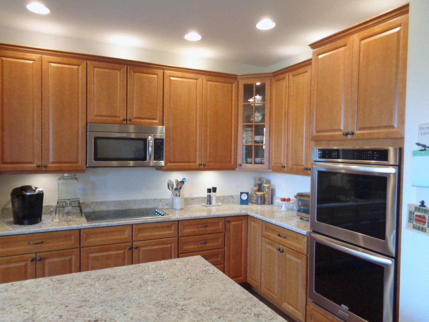 1157 Falcon Ridge Drive Elgin, IL 60124 - Photo 5 of 14 a kitchen with stainless steel appliances granite countertop a refrigerator sink and cabinets