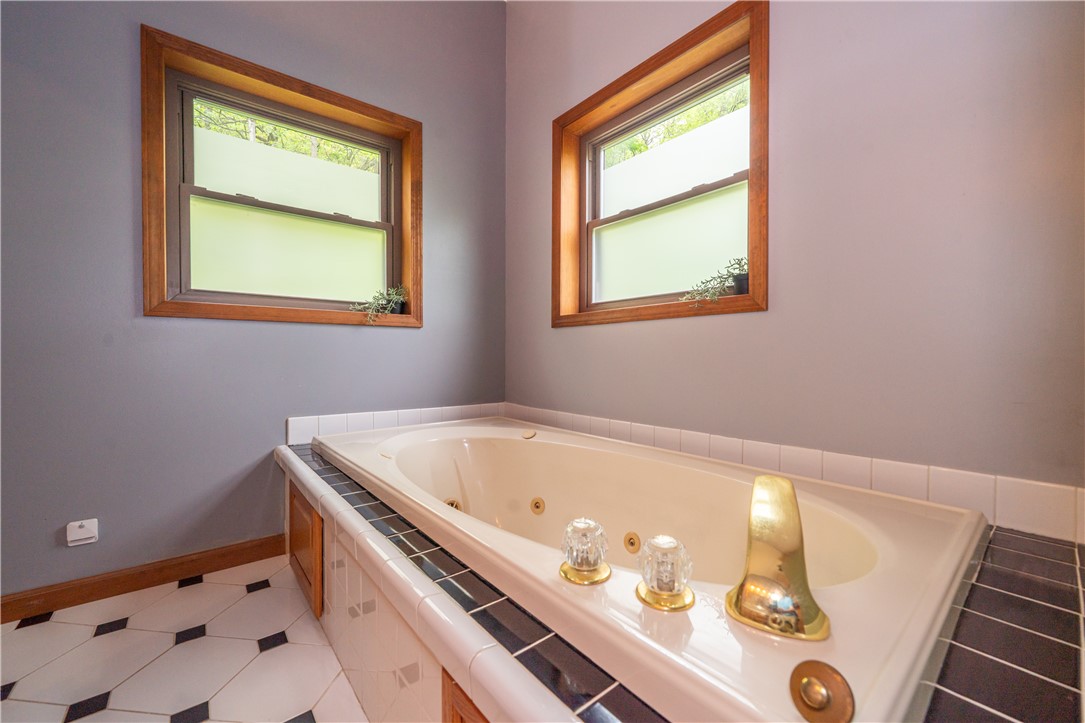 10584 New Biddinger Road Harrison, OH 45030 - Photo 32 of 61 Relax and unwind in this serene bathing space featuring a spacious soaking tub.
