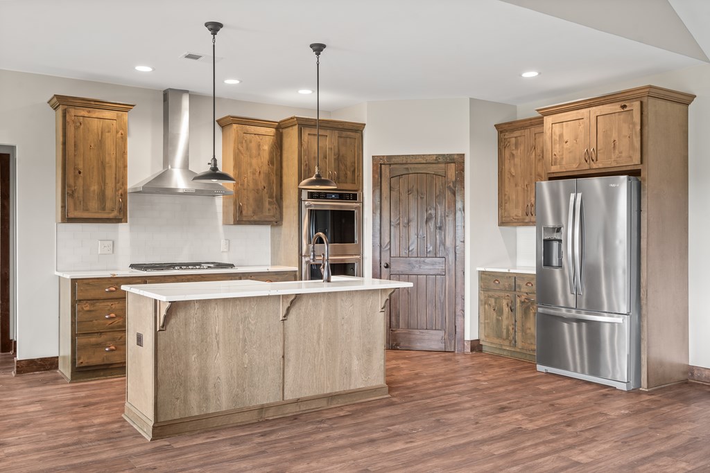39 Mountaintown Overlook Ellijay, GA 30540 - Photo 17 of 51 a kitchen with stainless steel appliances a refrigerator and a stove top oven