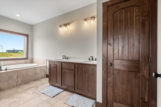 a bathroom with a bathtub and a sink