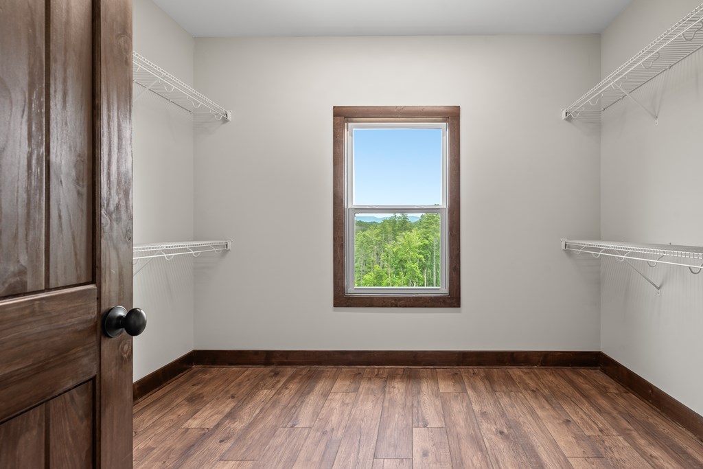 39 Mountaintown Overlook Ellijay, GA 30540 - Photo 30 of 51 a view of an empty room with wooden floor and a window