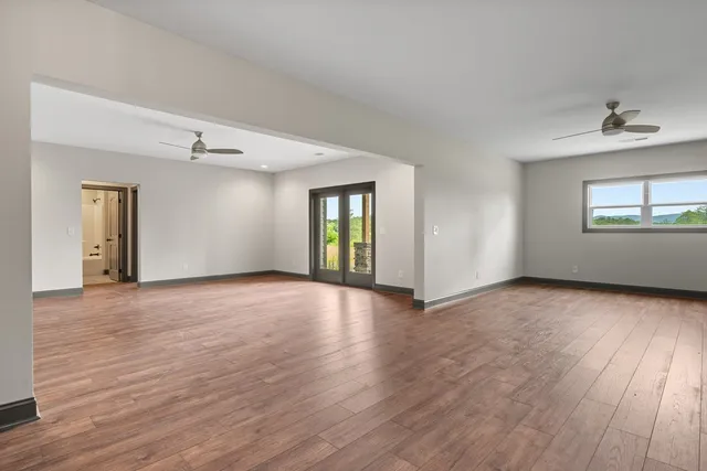 a view of a room with a white door