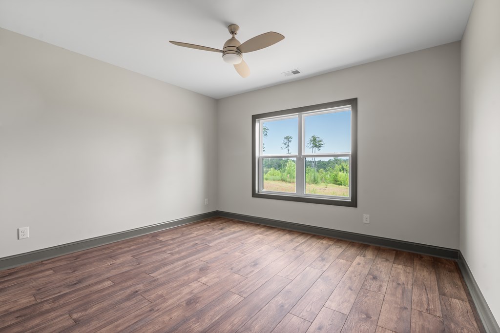 39 Mountaintown Overlook Ellijay, GA 30540 - Photo 43 of 51 a view of an empty room with wooden floor and a window