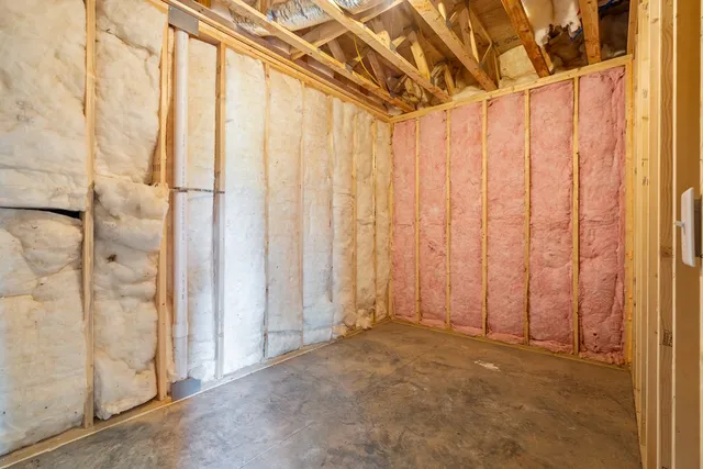 a view of a livingroom with a ceiling fan and window