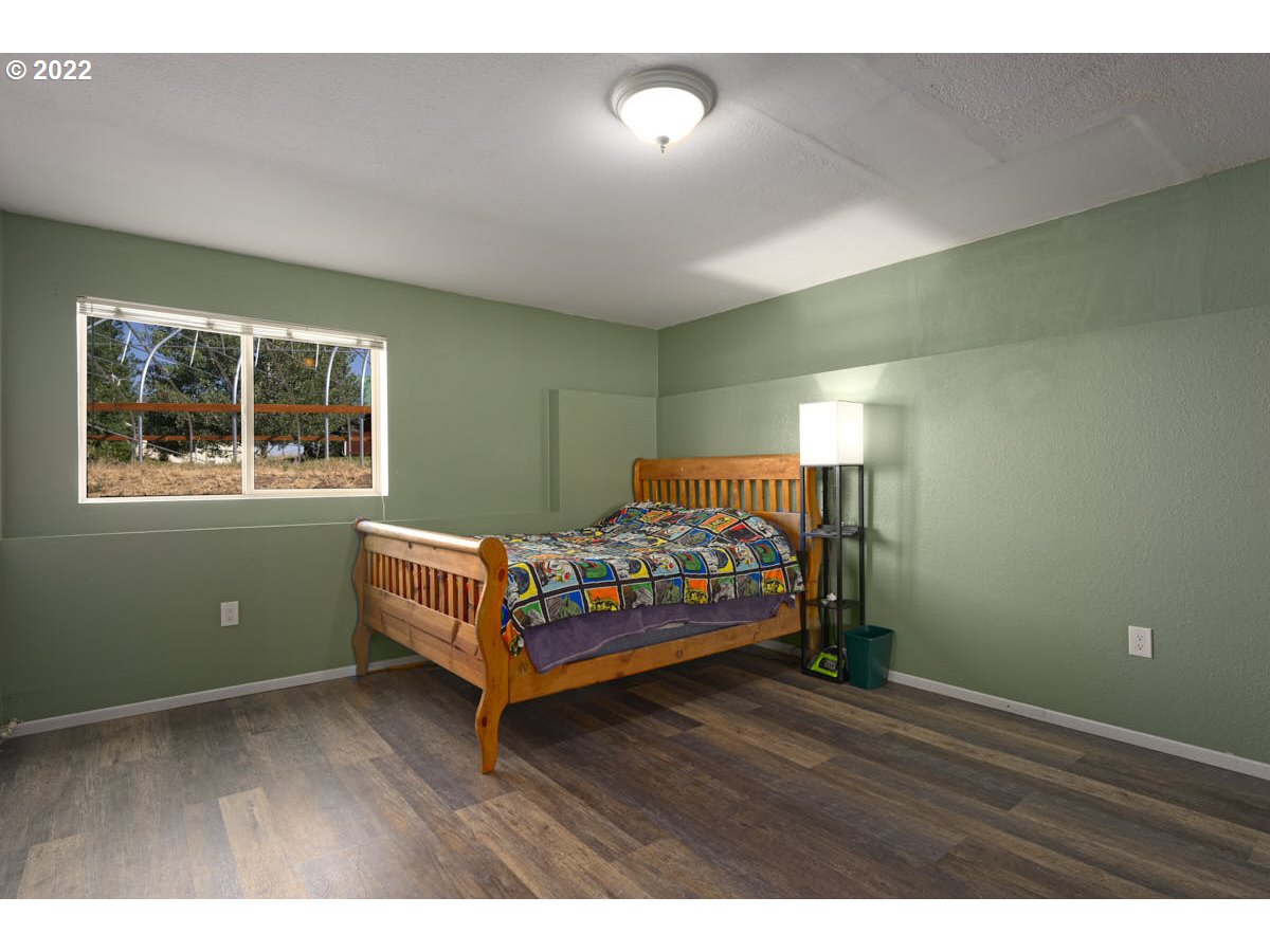 62333 Tucker Down Road Joseph, OR 97846 - Photo 16 of 32 a bedroom with a bed and window