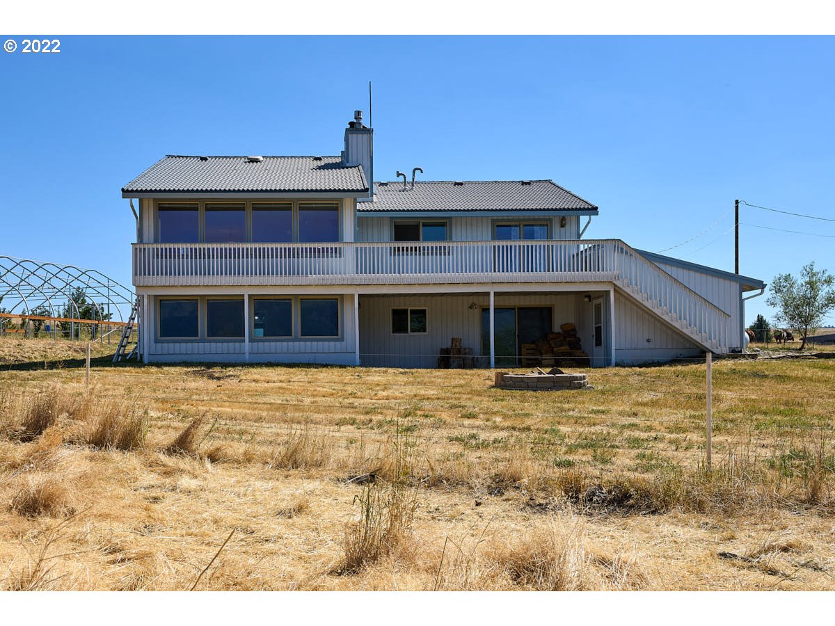 62333 Tucker Down Road Joseph, OR 97846 - Photo 26 of 32 a view of a building with a backyard