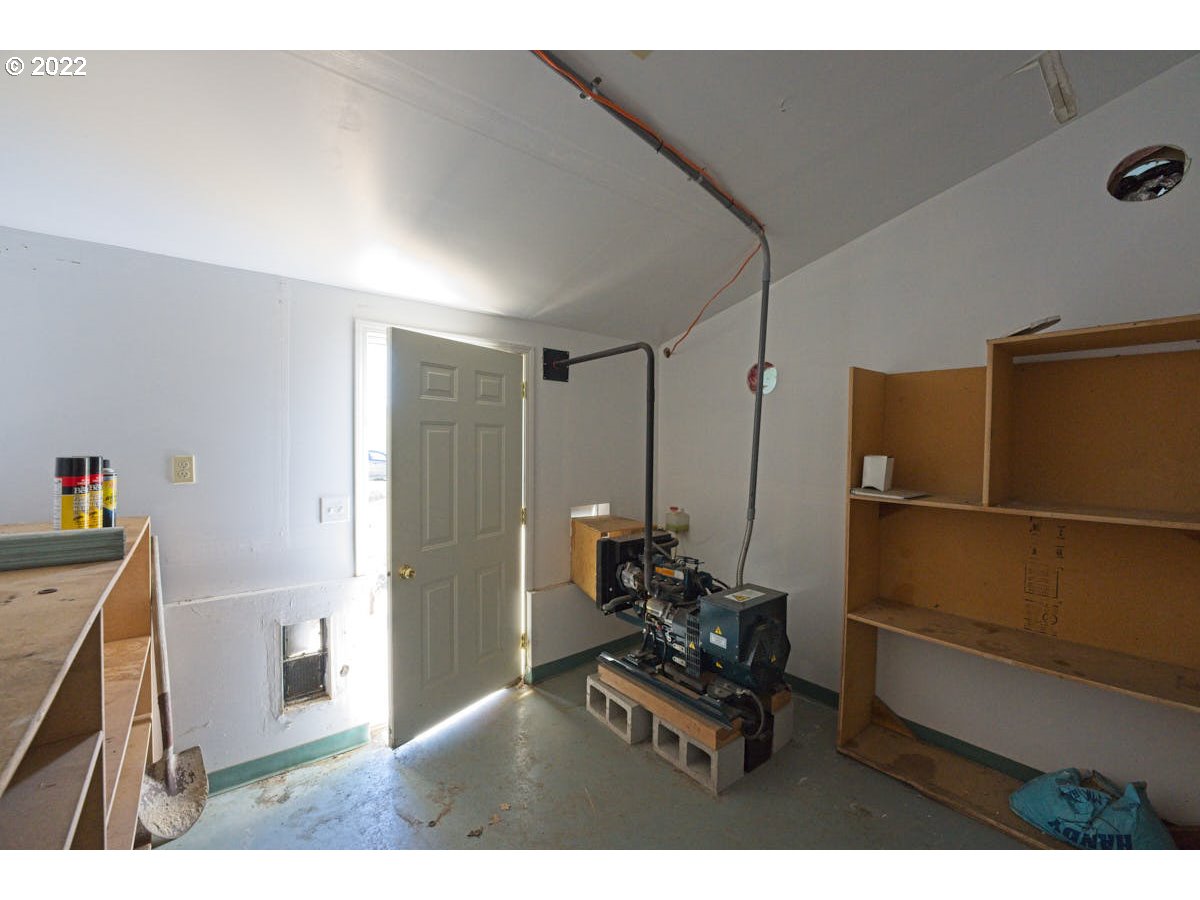 62333 Tucker Down Road Joseph, OR 97846 - Photo 28 of 32 a living room with furniture a dining table and a refrigerator